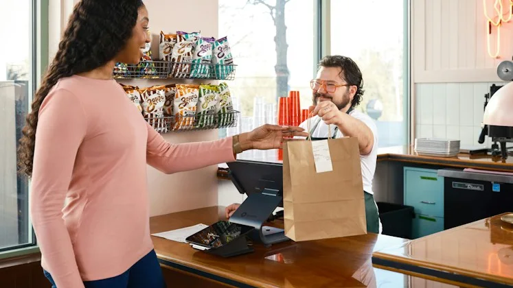Customer collecting an order at the counter